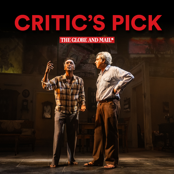 Two men stand under warm stage lighting in a furnished interior set. A younger man in a plaid shirt and headband gestures upward with one hand while an older grey-haired man in a light shirt and brown trousers stands beside him with one hand on his hip. Large red text across the top reads “CRITIC’S PICK,” with “THE GLOBE AND MAIL” in a red banner below.