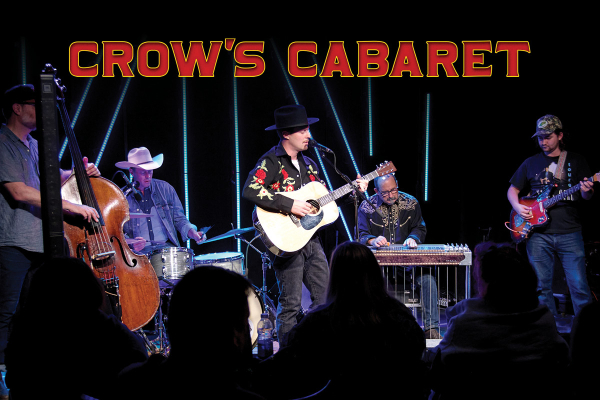 Photo of a band playing on stage with Crow's Cabaret written above